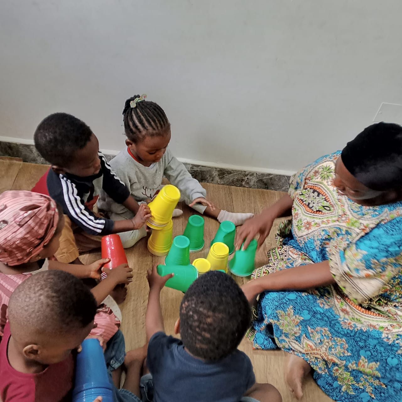 Cup-stacking game with young learners