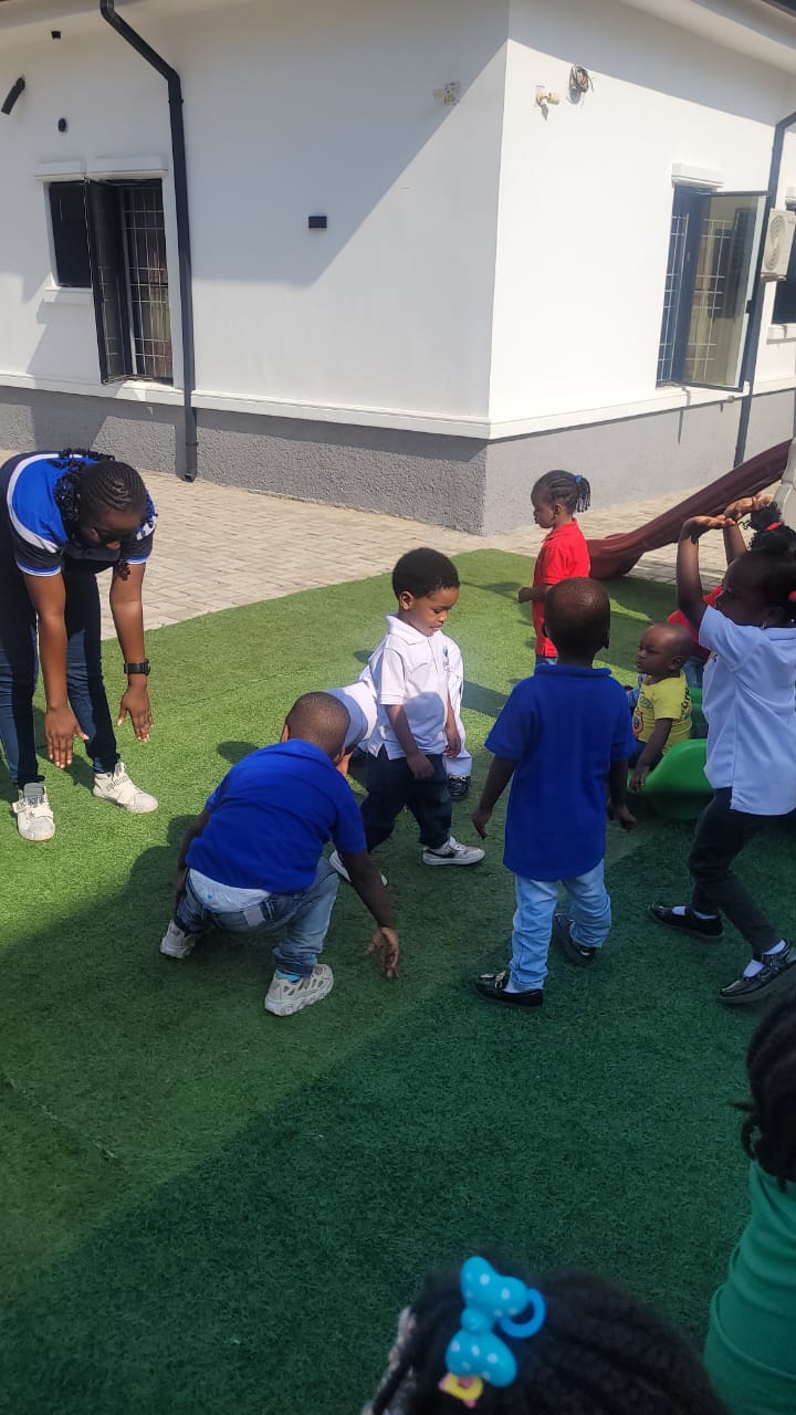 Children playing games on the outdoor turf