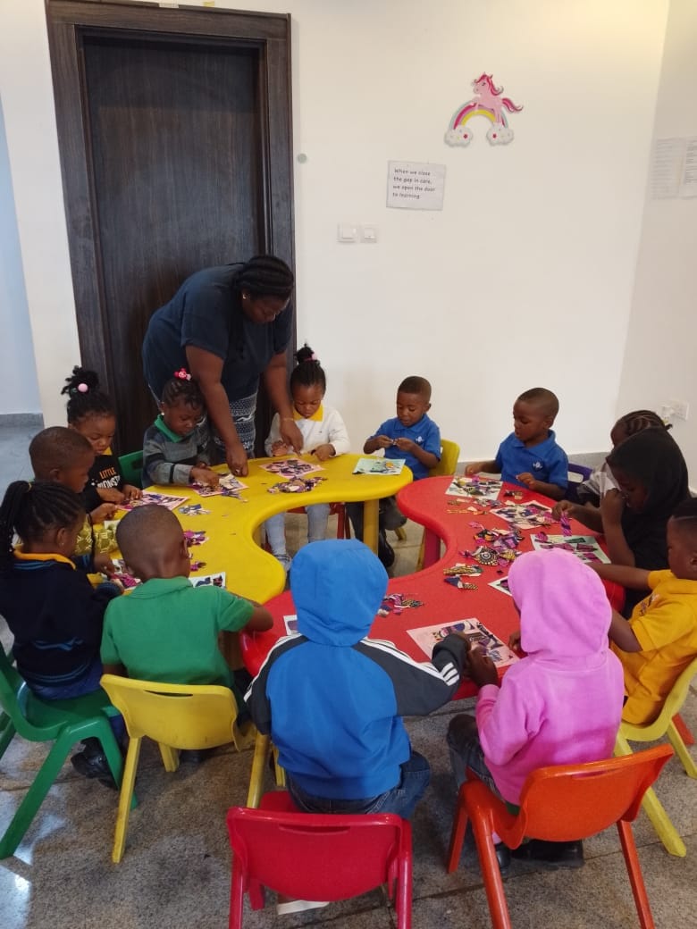 Children building puzzles at the activity tables